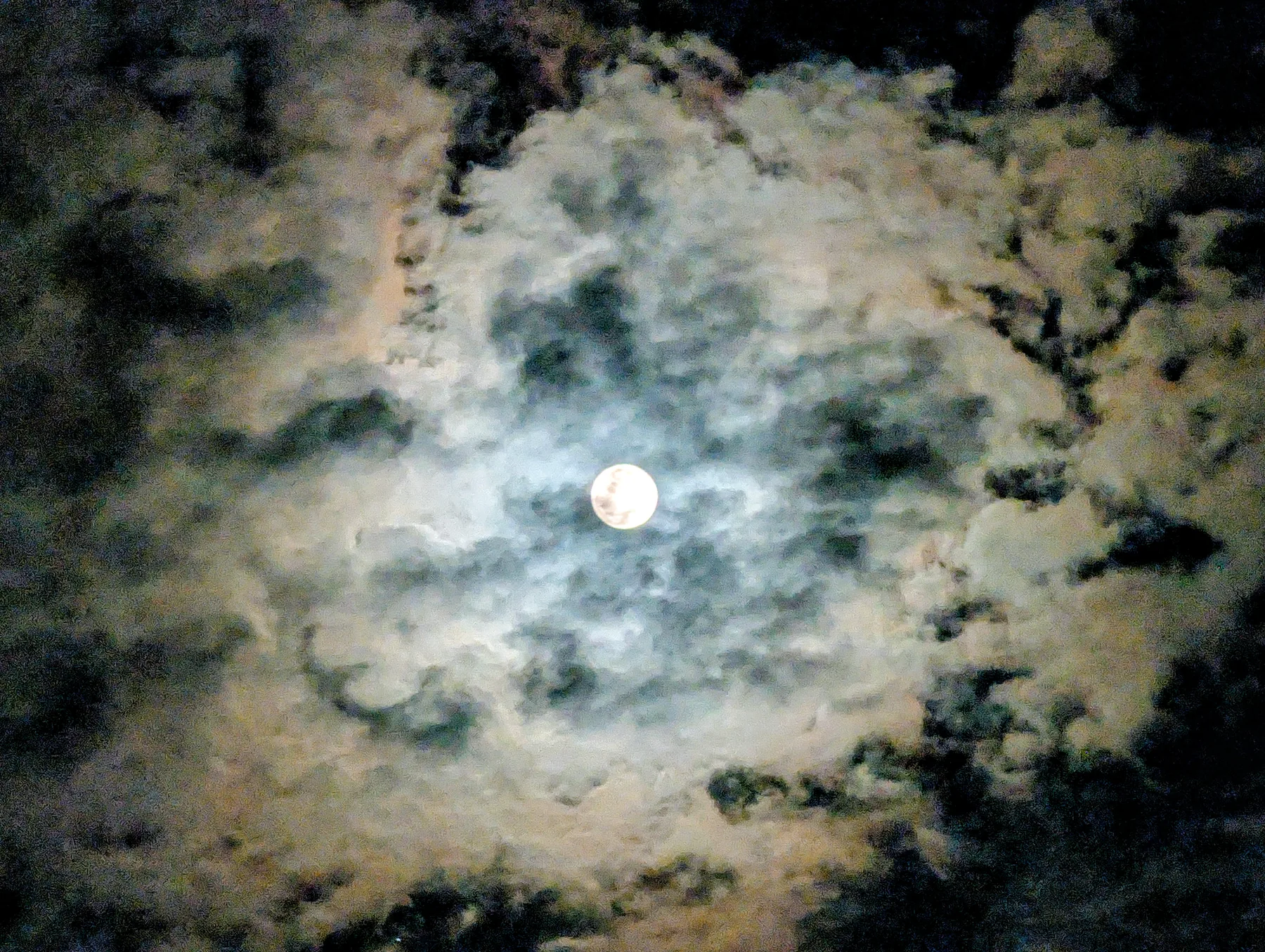 Moon Between Clouds